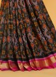 Black And Rani Patola Woven Pure Silk Saree